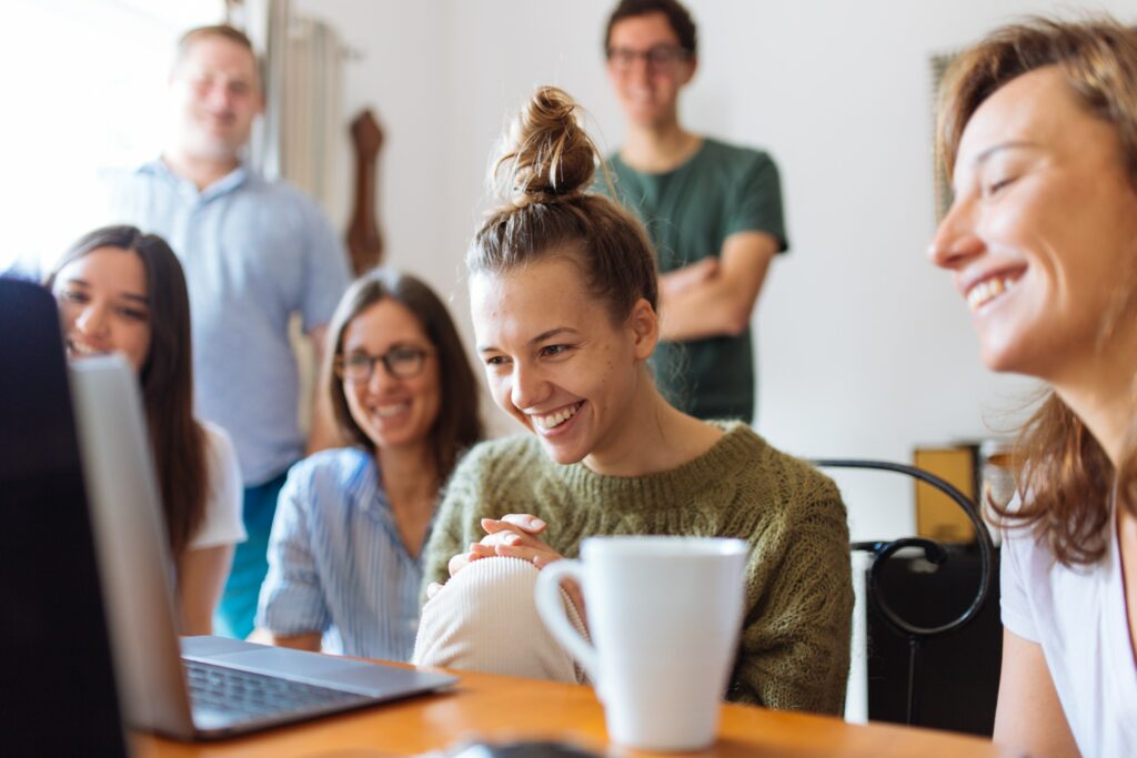 happy people at laptop coffee