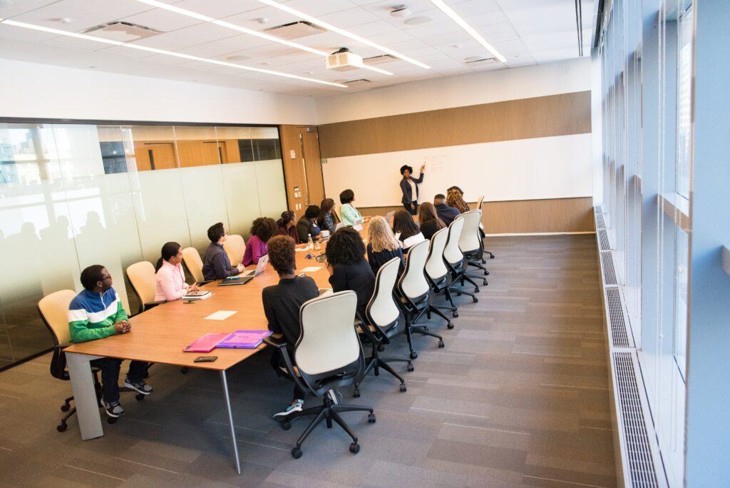 adults at conference table learning